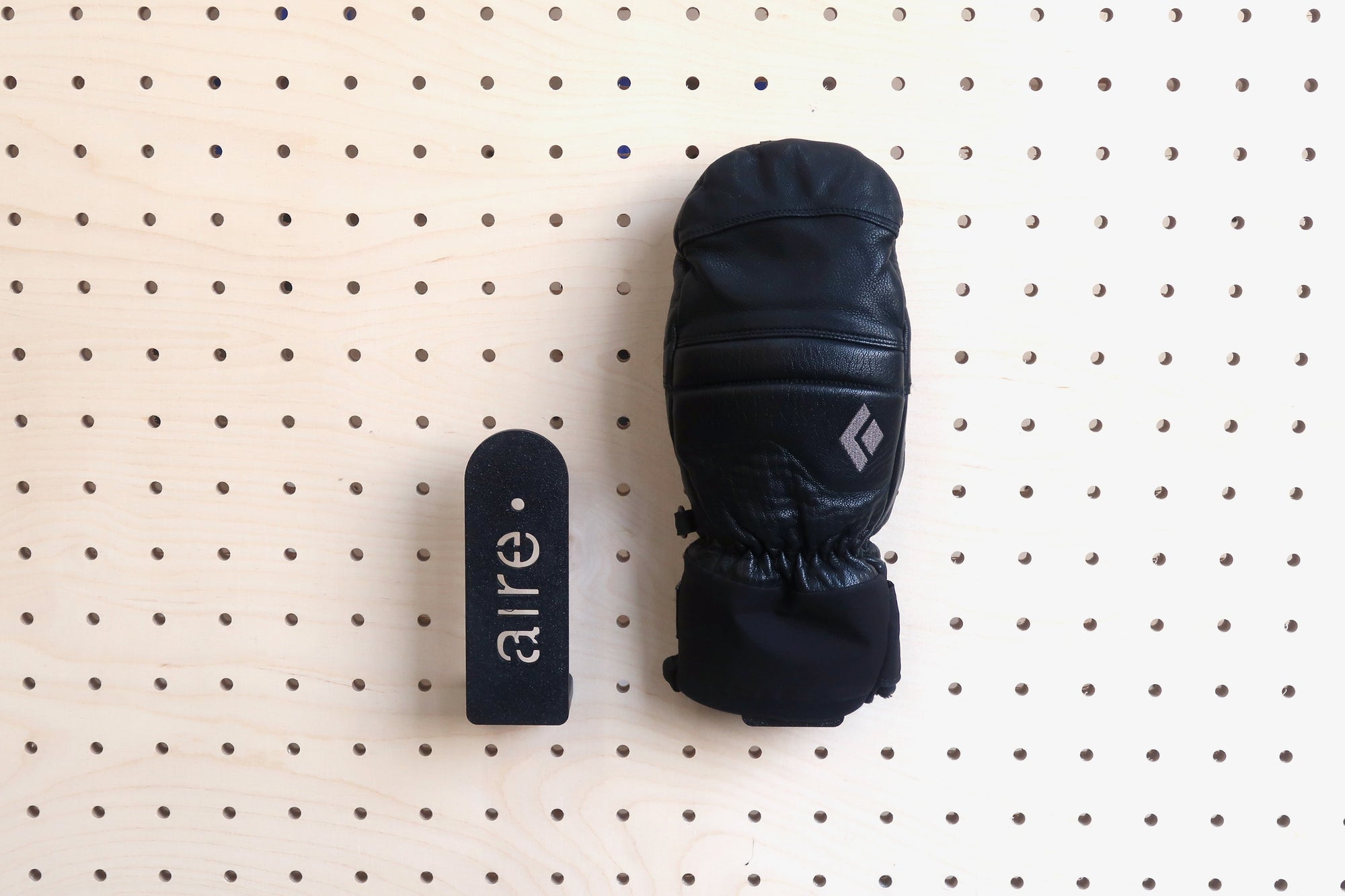 Glove and mitten holder for perforated panels