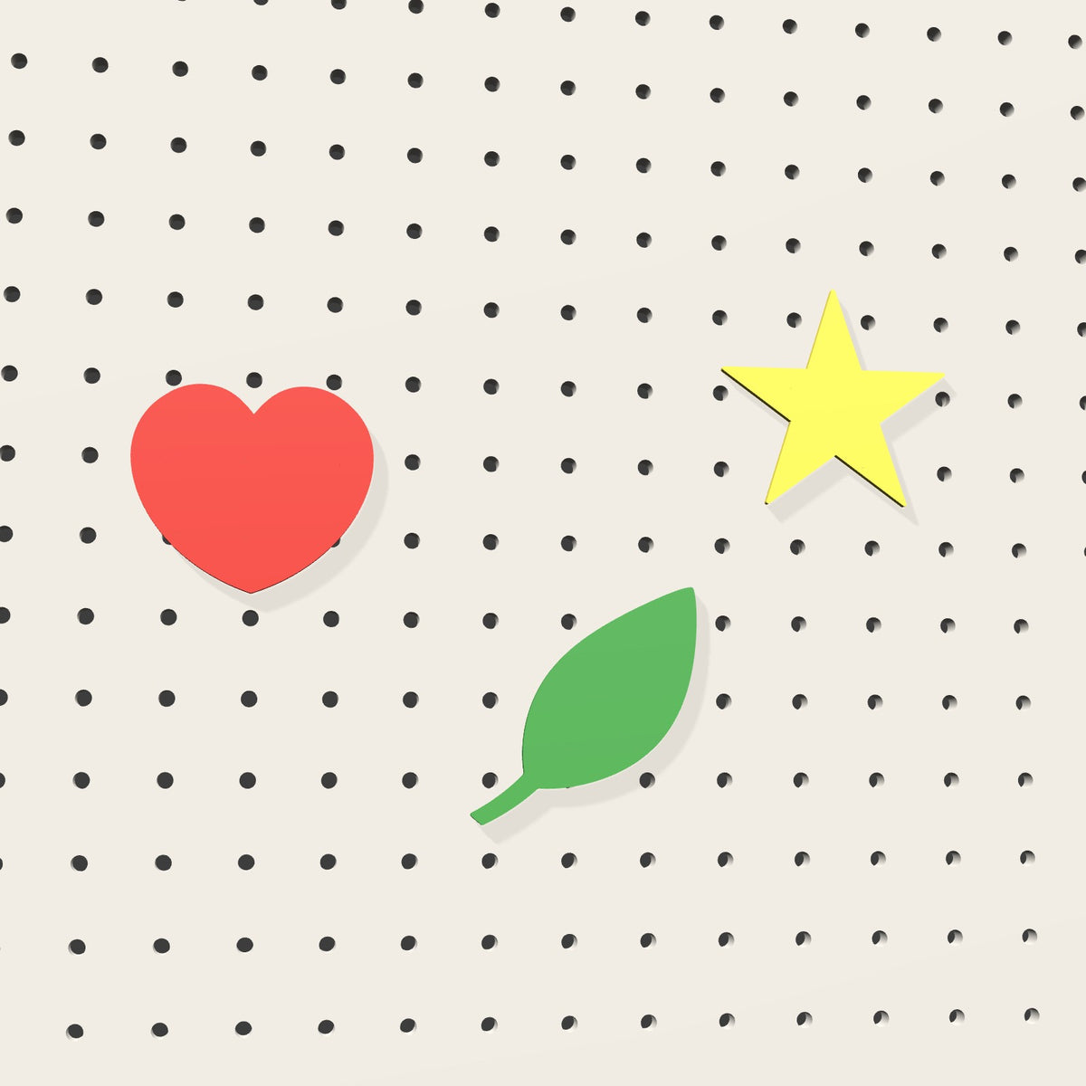 Heart, leaf and star pictograms on a pegboard – 3D render